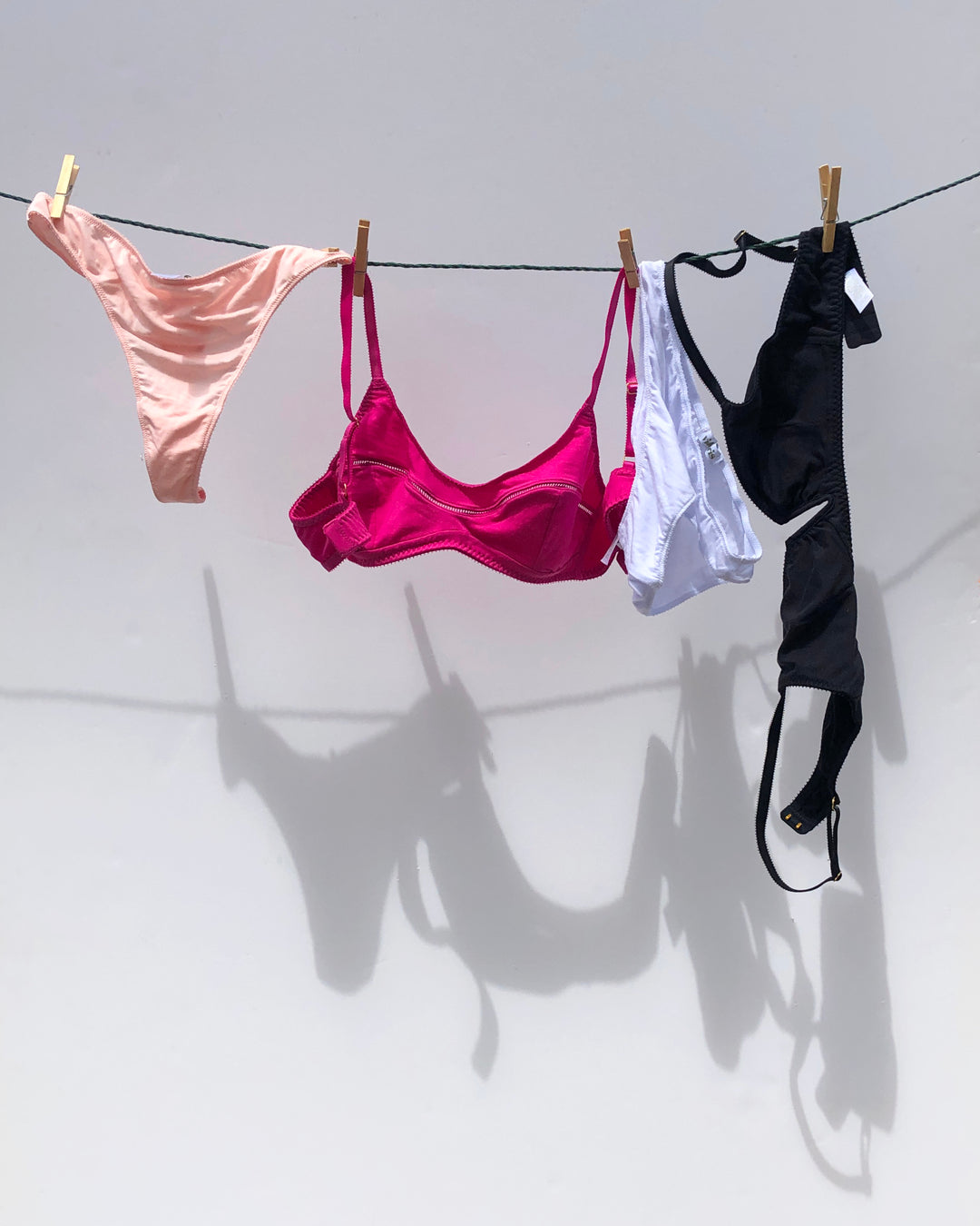 Whitney bikini in Rosy Pink, Maggie Bra in Bohemian Pink, Whitney Bikini in Pure White, Angela Bra in Shield Black. We create Lingerie that is non-toxic, breathable and most importantly Oeko-Tex Standard 100 certified. No PFAS!