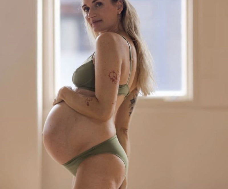 customer wearing belle maternity bra in shield, selfie