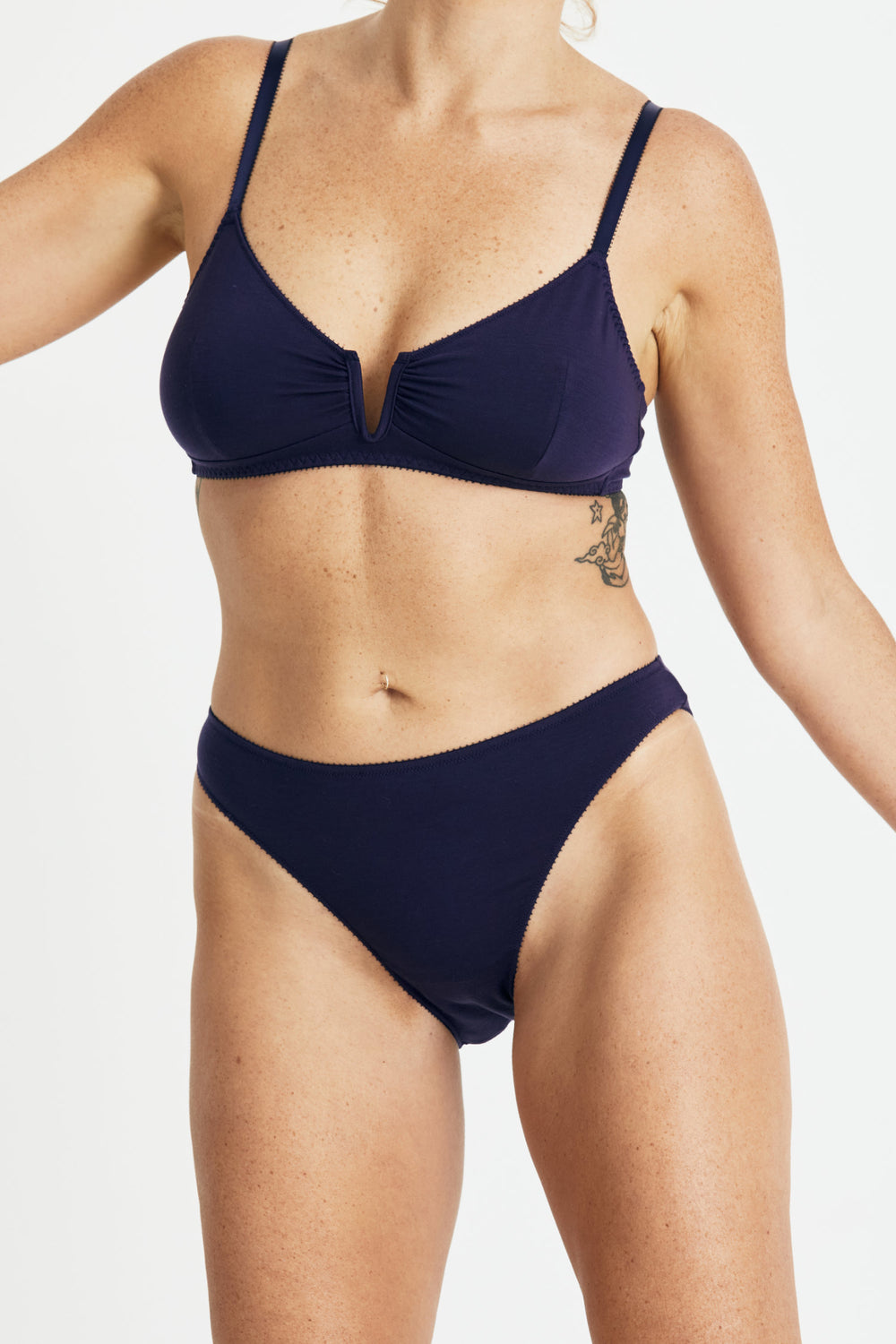 Videris Lingerie Angela underwire free soft cup bra in navy TENCEL™ features a triangle shaped cup and front gathering detail